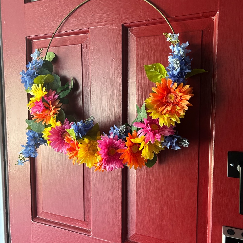Vibrant Floral Wreath with Blue and Orange Flowers